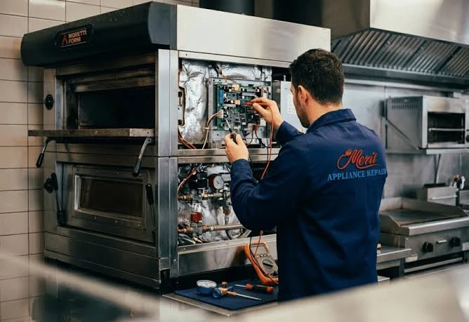 Technician troubleshooting an appliance control board